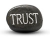 rock with trust chiseled into it